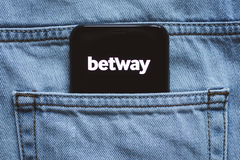 Betway betting app logo on the mobile phone screen in jeans pocket