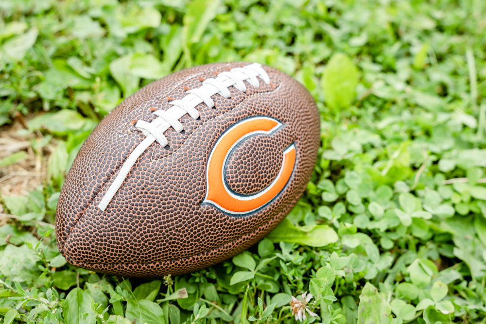 Football with Chicago Bears logo the on grass