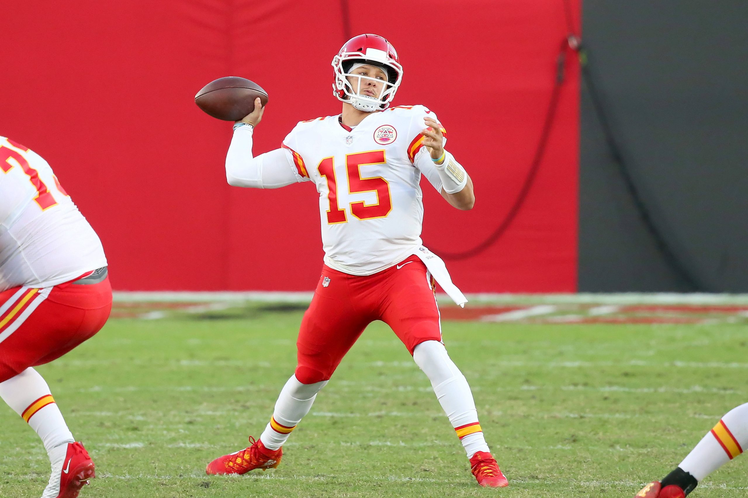 American football player throws a pass during a match