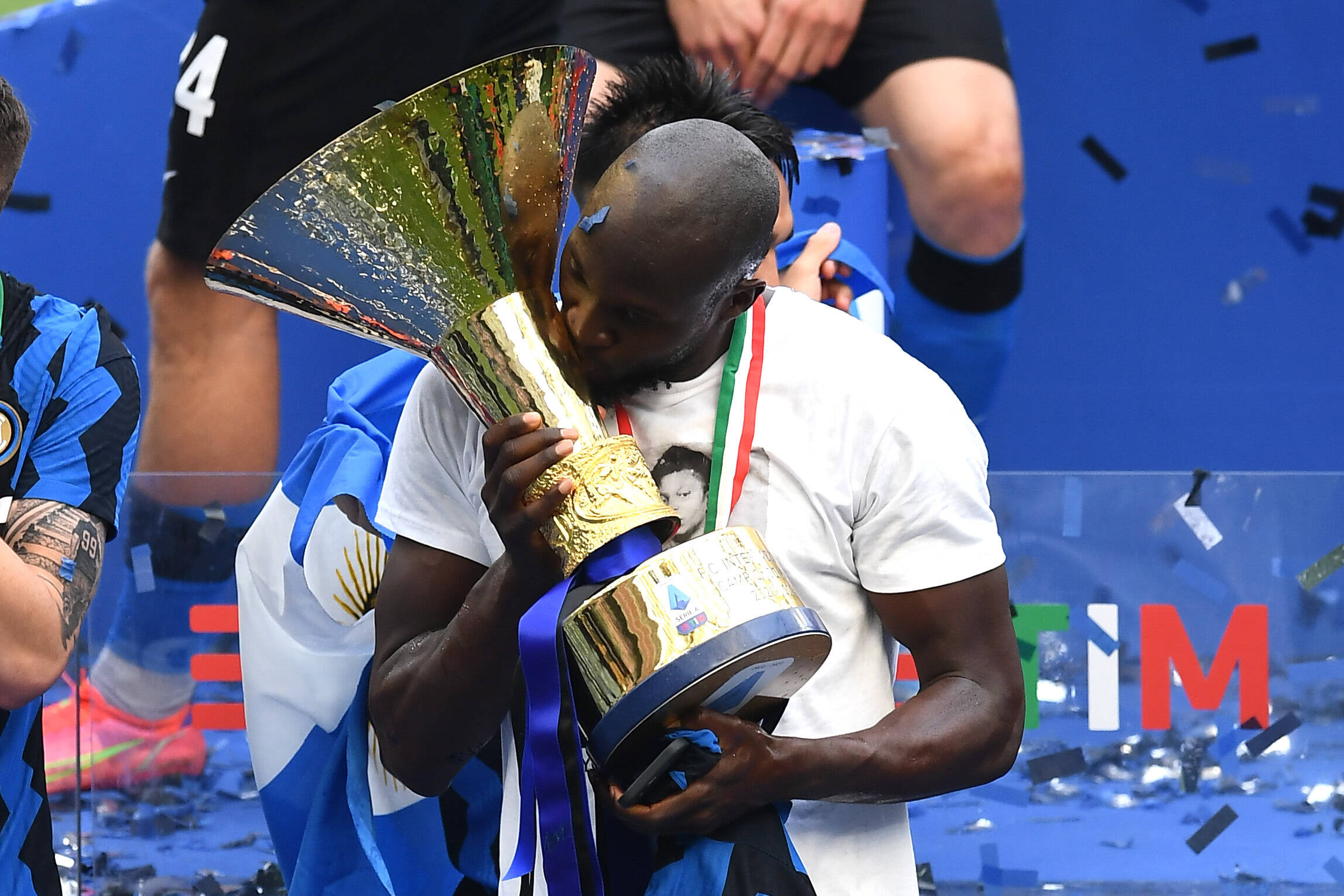 Football player kisses a trophy