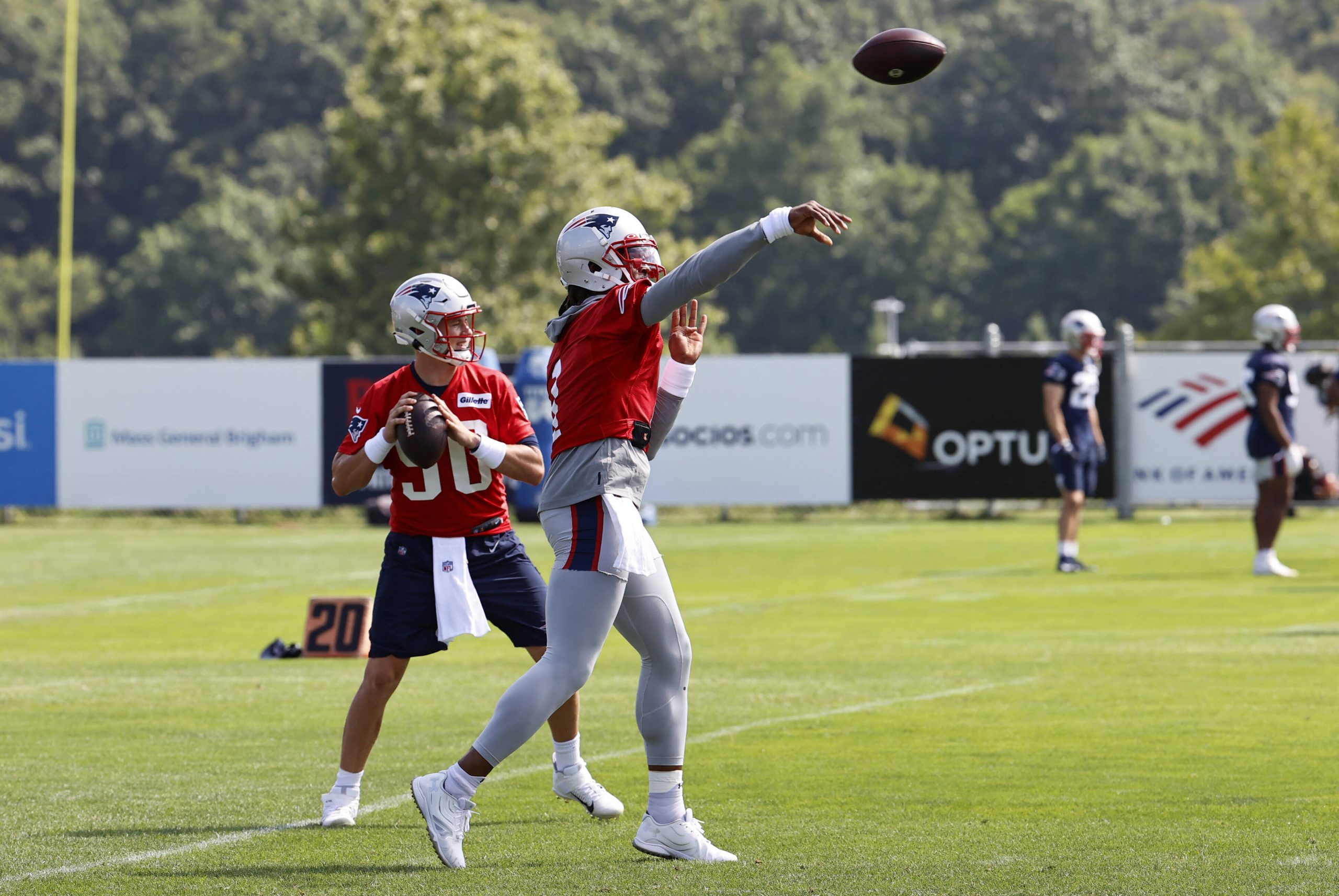 American football runs a drill during training camp