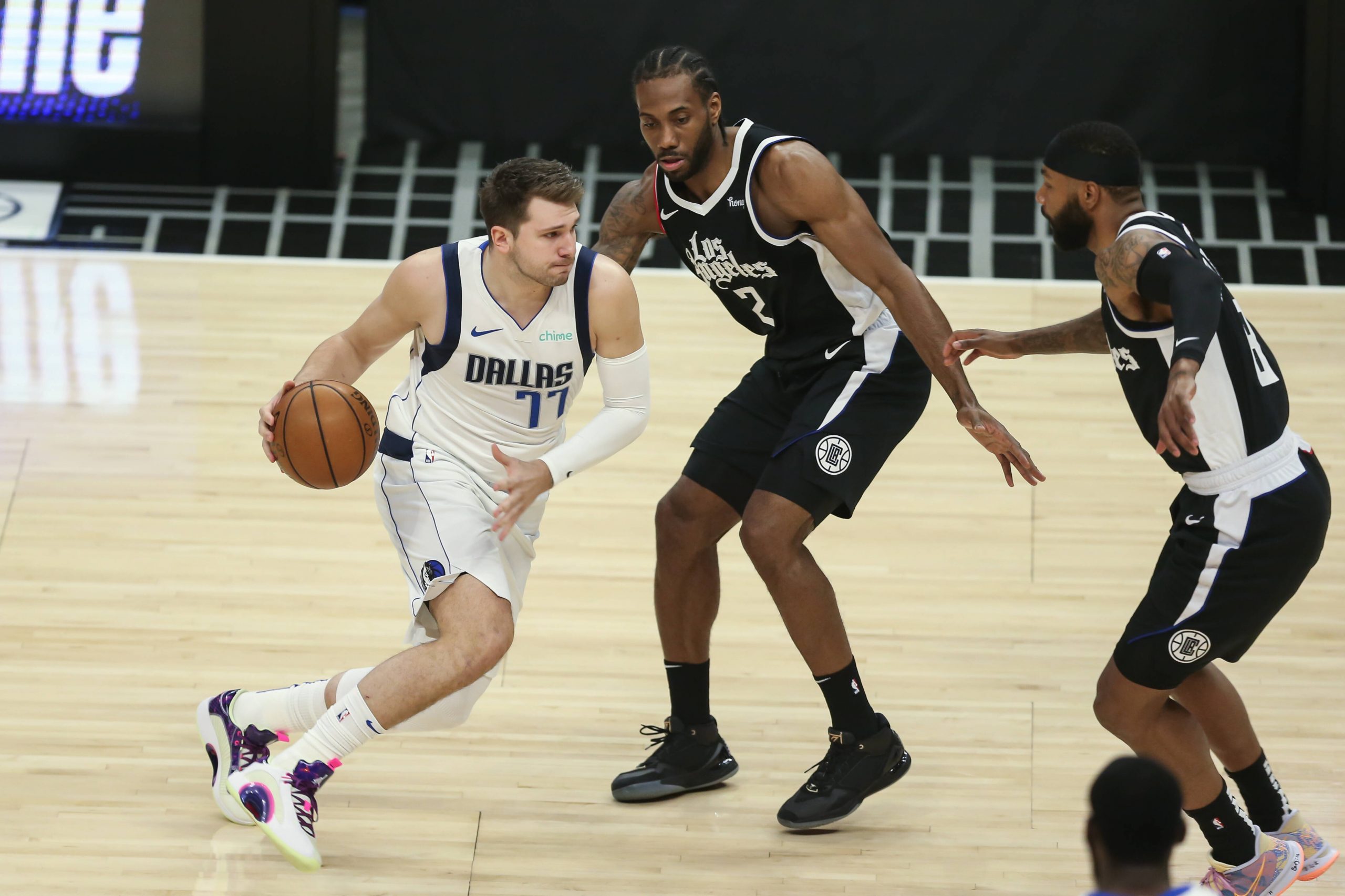 Basketball player runs with the ball during a game