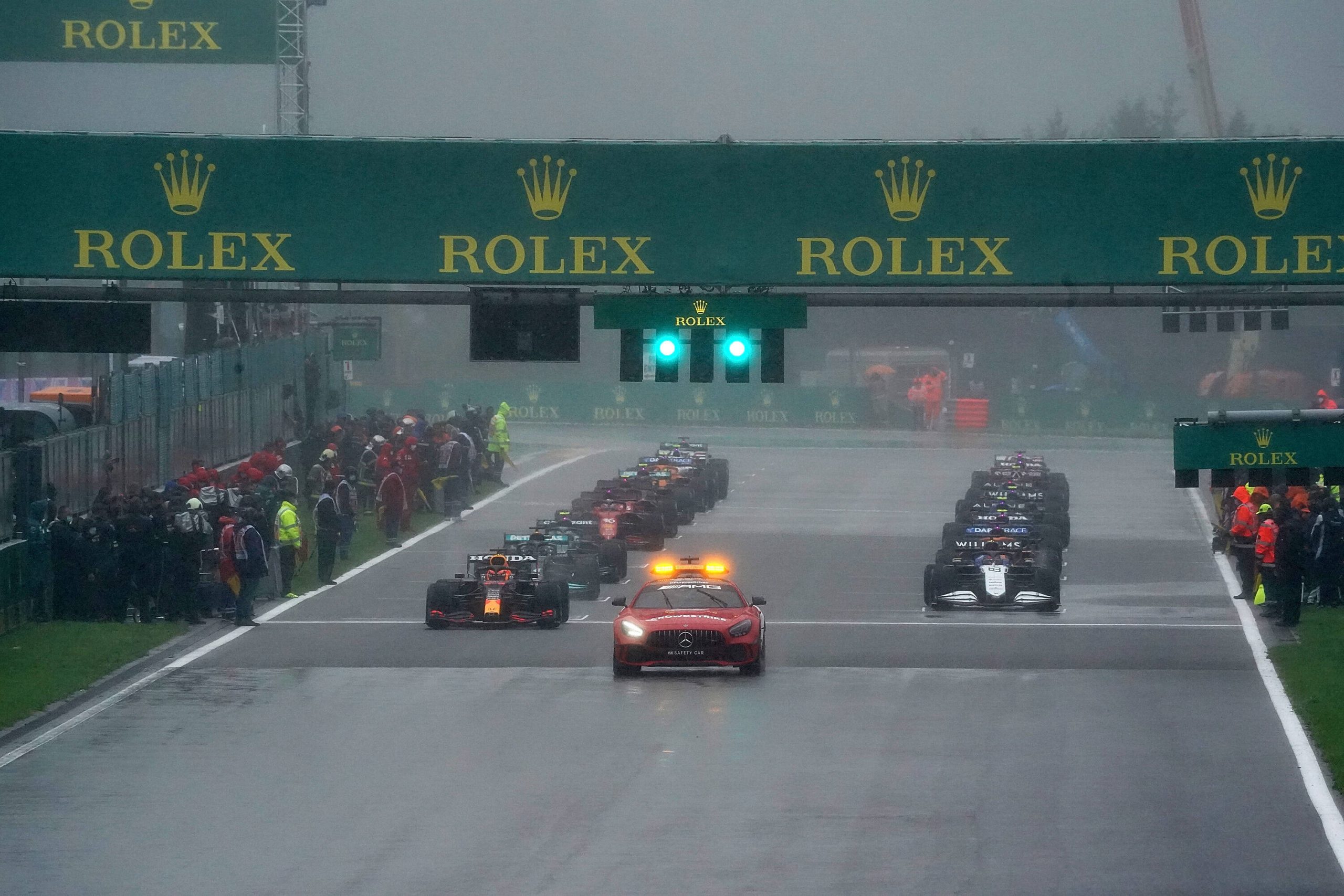 Formula one: Cars line up on the grid waiting to start behind the safety car