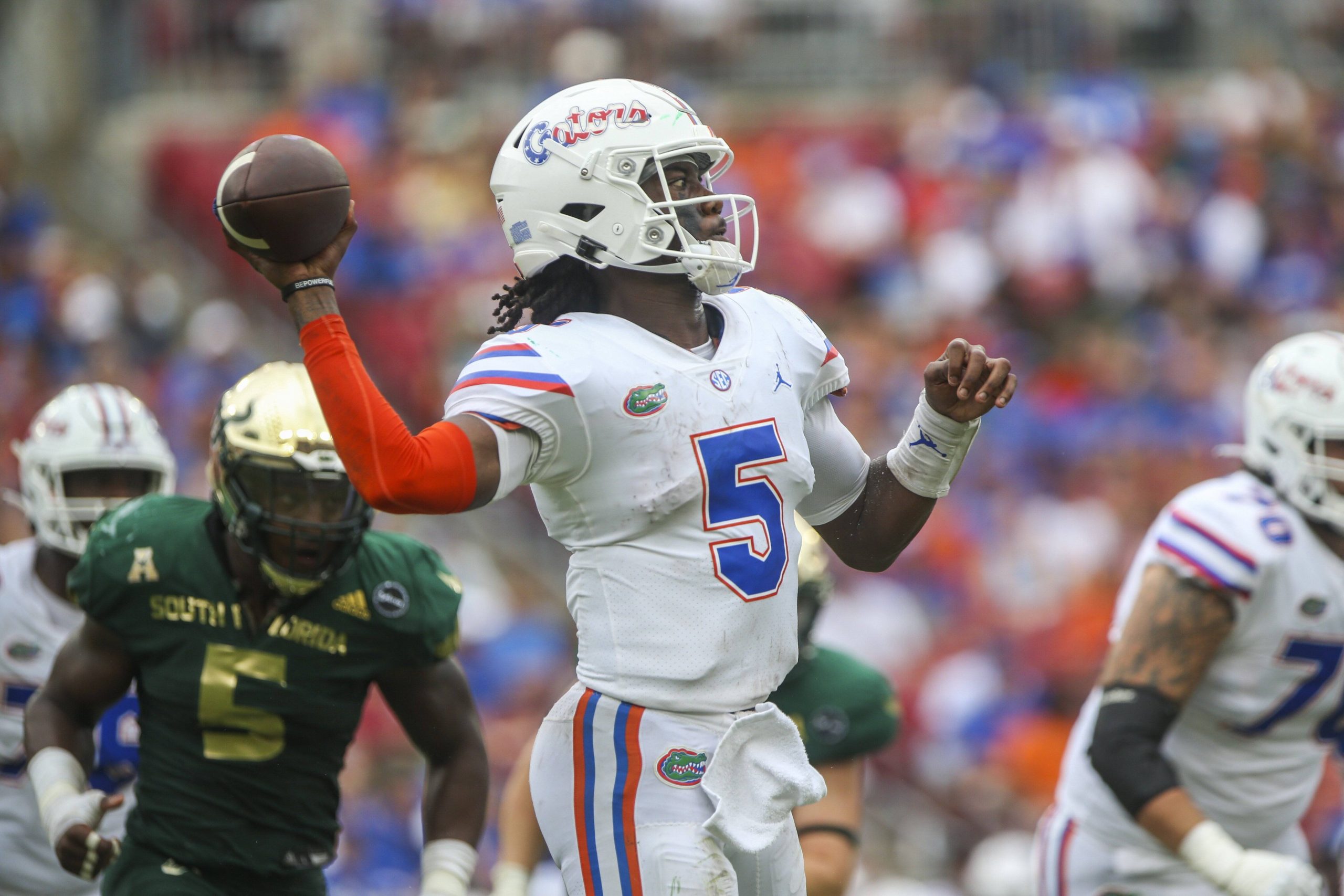 Ametican football player passes during a game