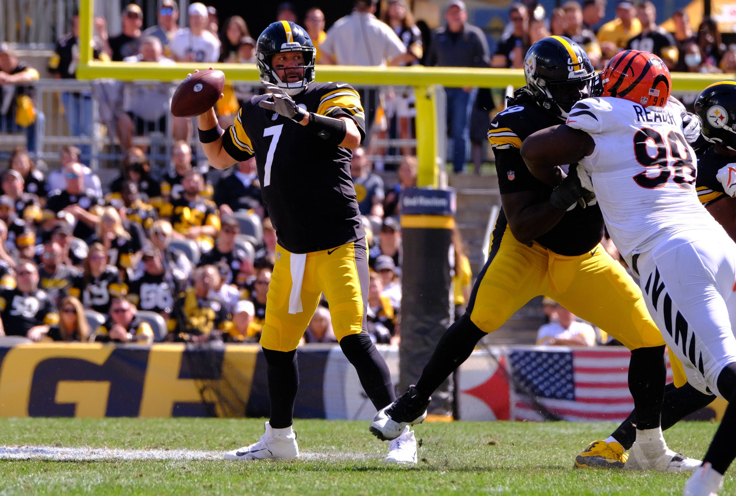 American football player throws the ball during a game