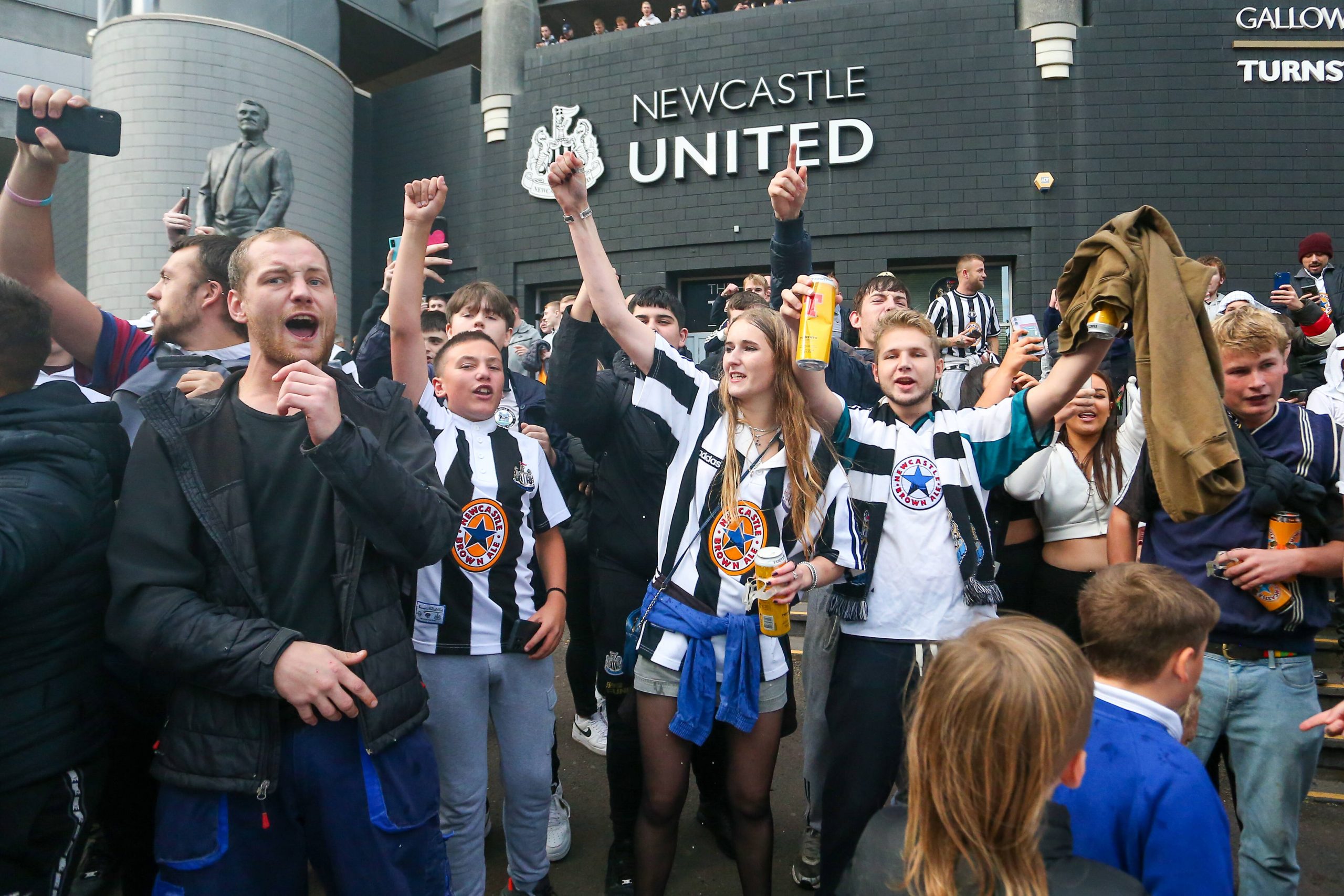 The fans celebrate in front of the Newcastle United Stadium