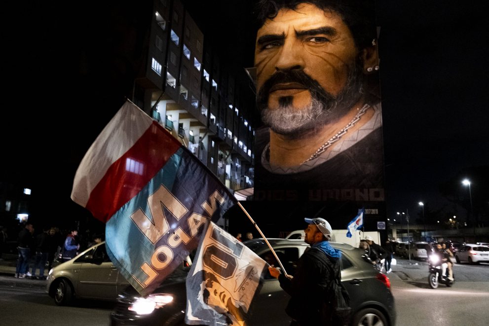 Fans crowd under the Diego Armando Maradona mural to celebrate his birthday