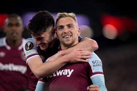 Two football players celebrates after scoring during a game