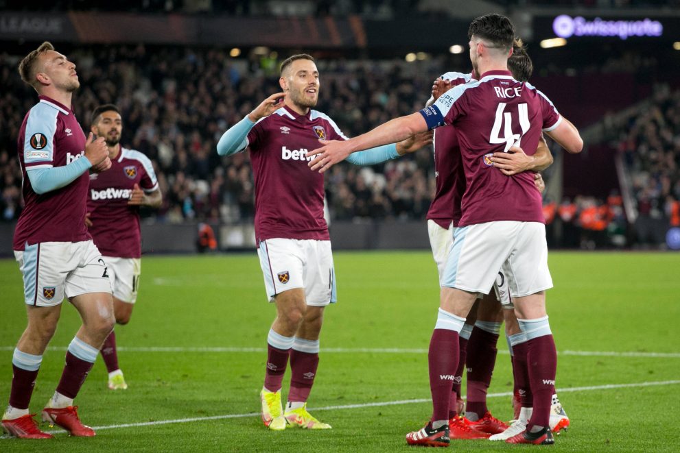 A football player celebrates with his team mates after scoring during a game