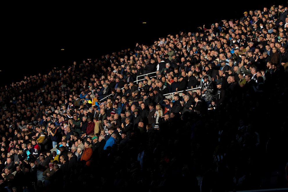 Part of the stands with the spectators standing up