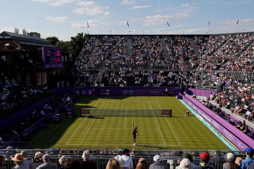 Tennis player serves during a tennis match