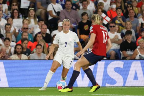 Julie Blakstad attempts to tackle the ball from Beth Mead during the England vs Norway match in the 2022 Women's Euros.