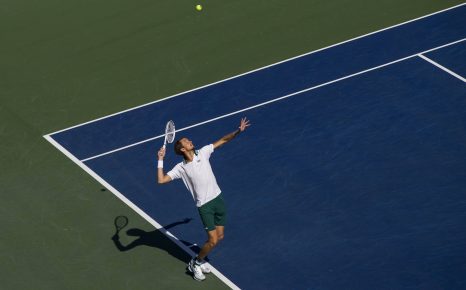 Daniil Medvedev in mid serve action on a hard tennis court in Toronto