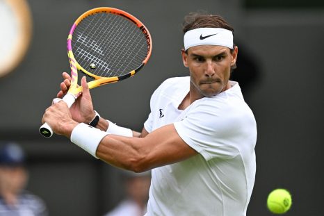 Rafa Nadal playing a backhand shot at Wimbledon