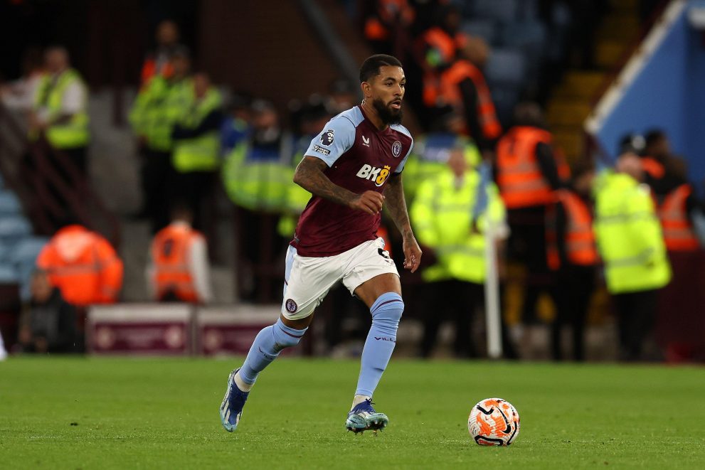 douglas luiz in villa kit with the ball at his feet